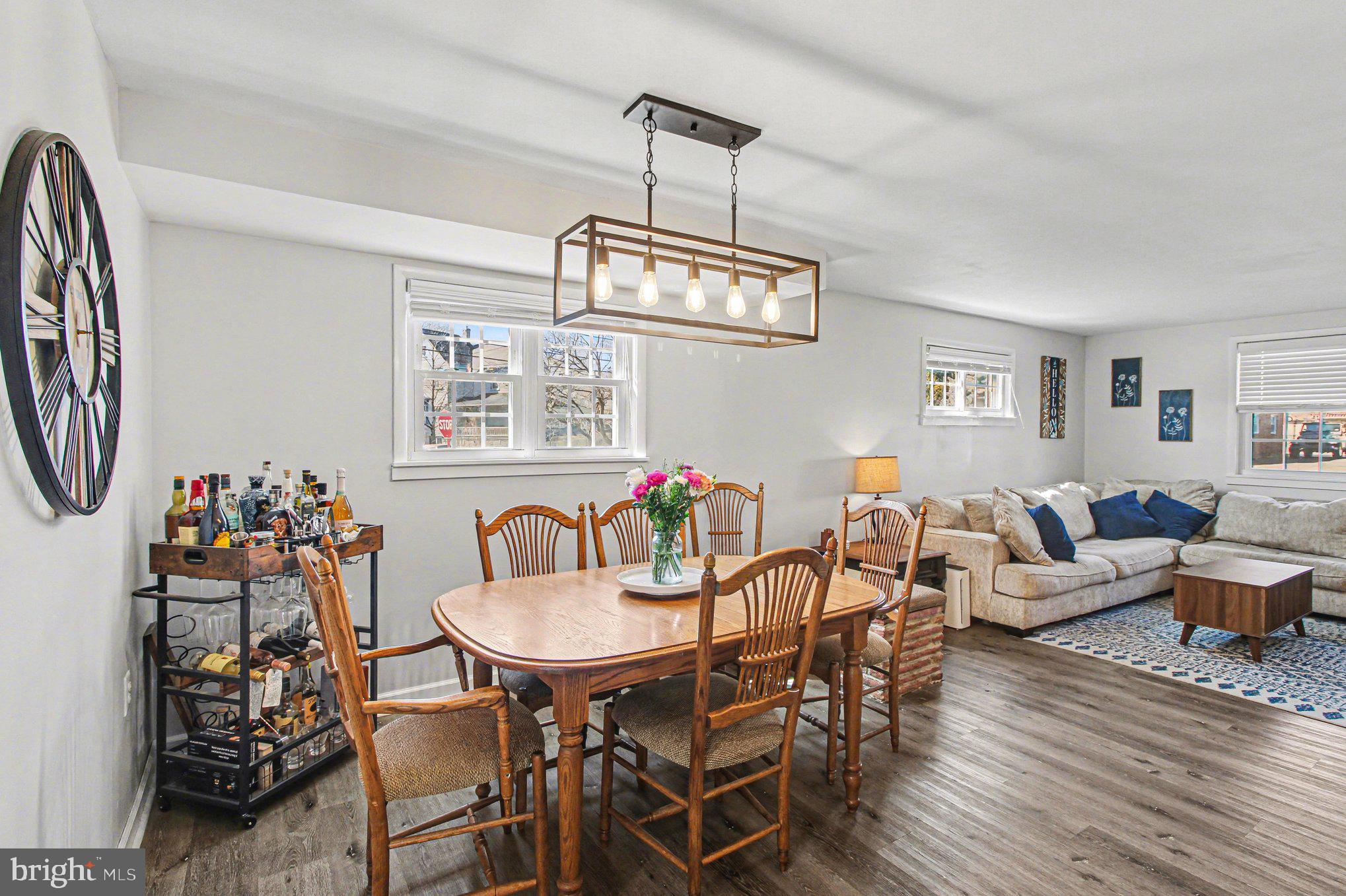 822 Hancock Street Ridley Park, PA 19033 - Photo 13 of 30 a view of a dining room with furniture a chandelier and wooden floor