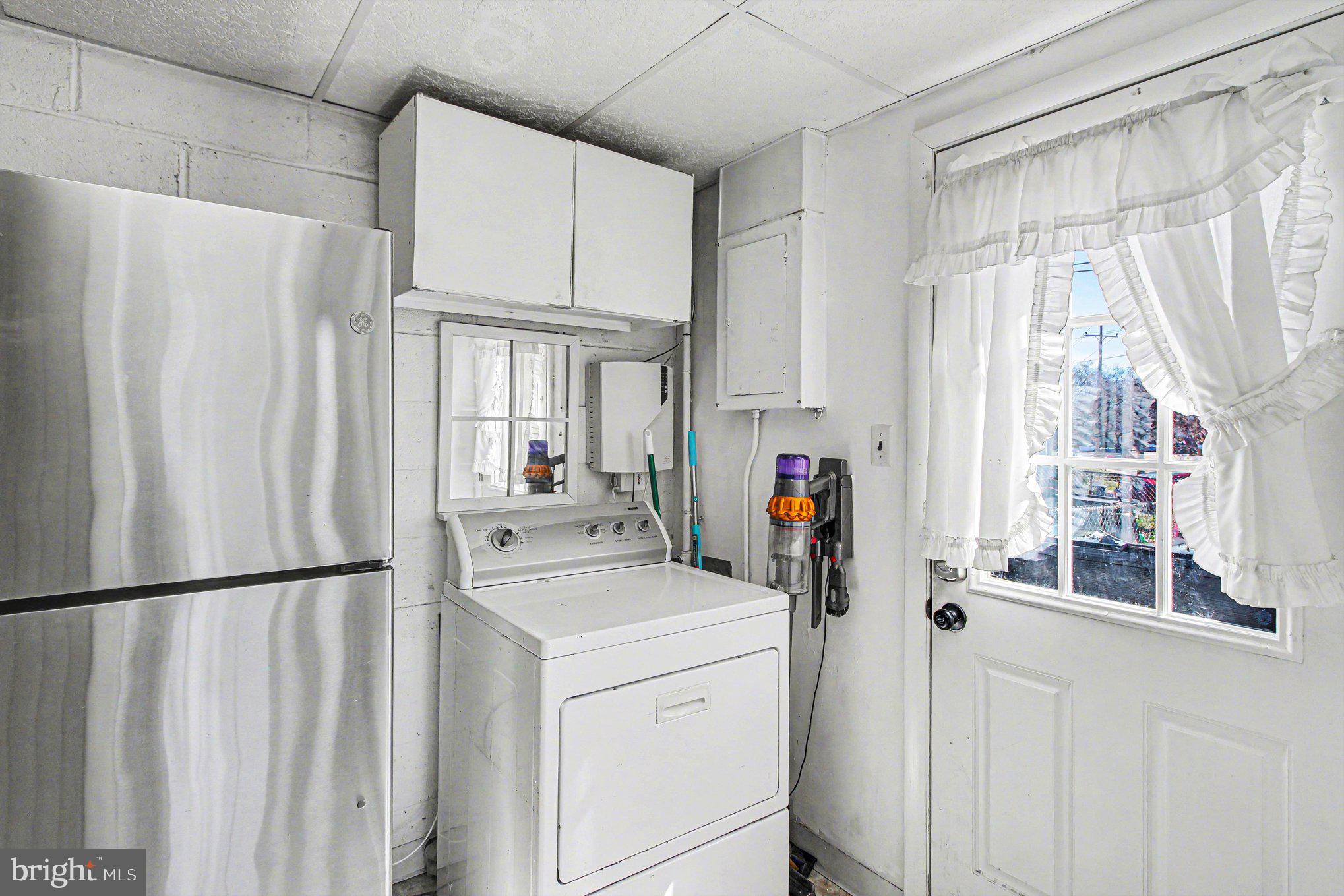 822 Hancock Street Ridley Park, PA 19033 - Photo 15 of 30 a view of a kitchen with white cabinets and refrigerator
