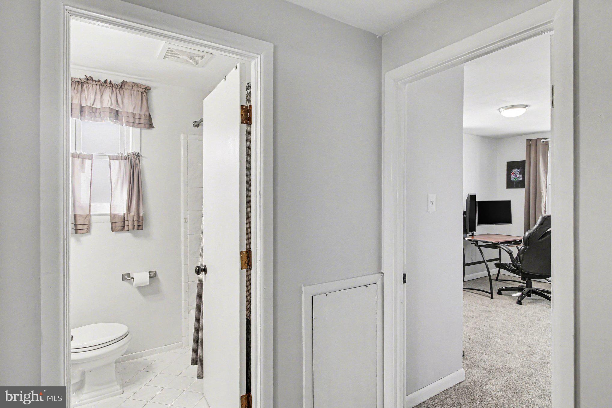 822 Hancock Street Ridley Park, PA 19033 - Photo 25 of 30 a bathroom with a toilet a sink and a mirror