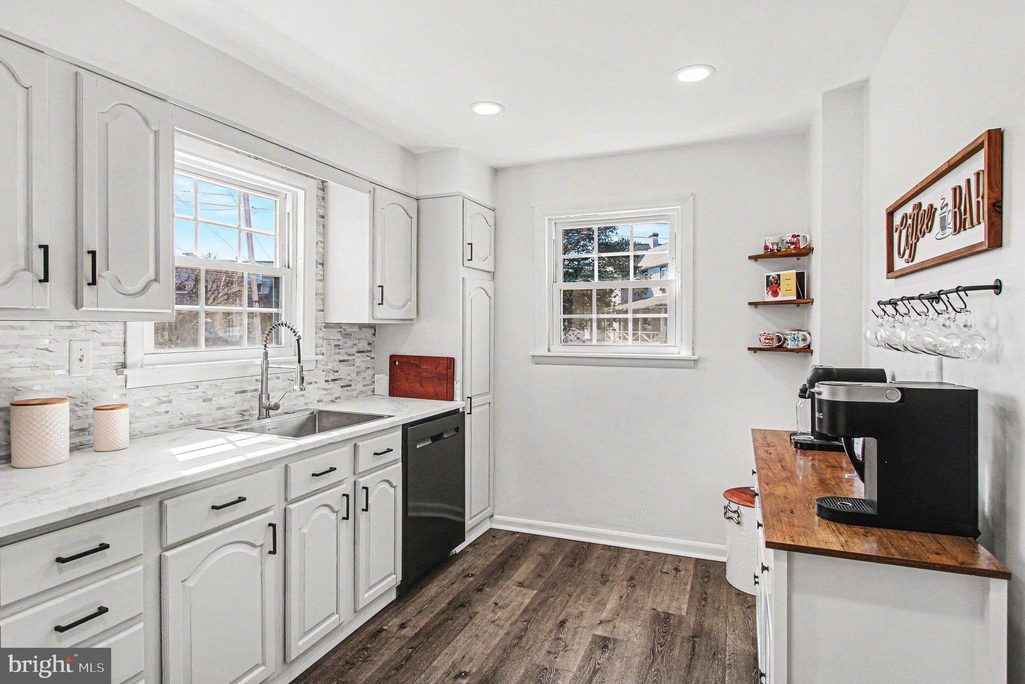 822 Hancock Street Ridley Park, PA 19033 - Photo 9 of 30 a kitchen with stainless steel appliances granite countertop a sink stove and cabinets