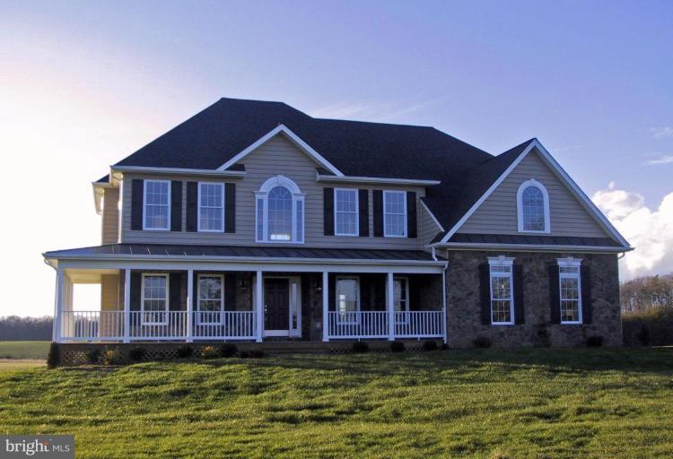 a view of a brick house with a yard