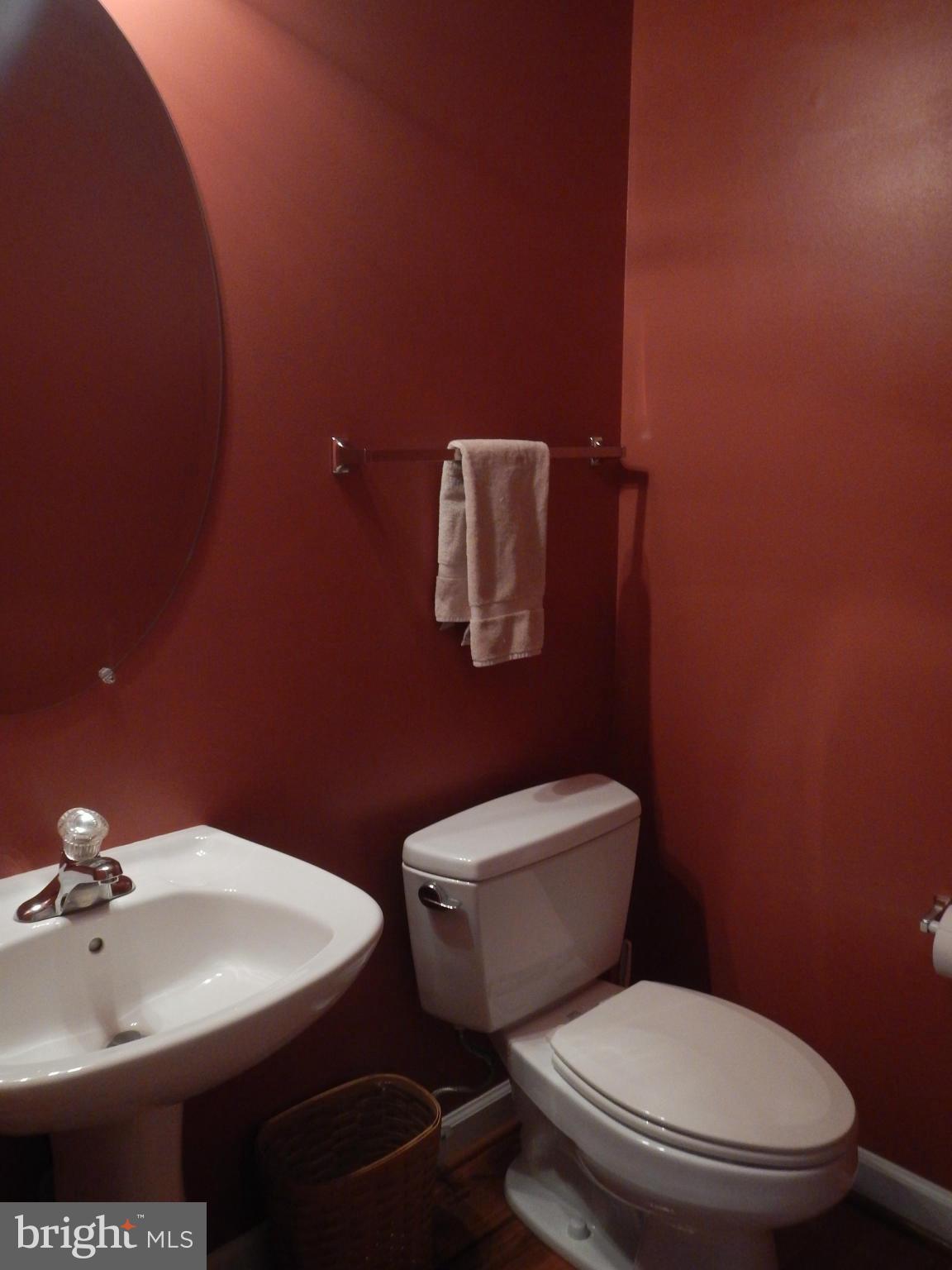 13602 Union Church Road Sumerduck, VA 22742 - Photo 15 of 30 a bathroom with a toilet a sink and mirror