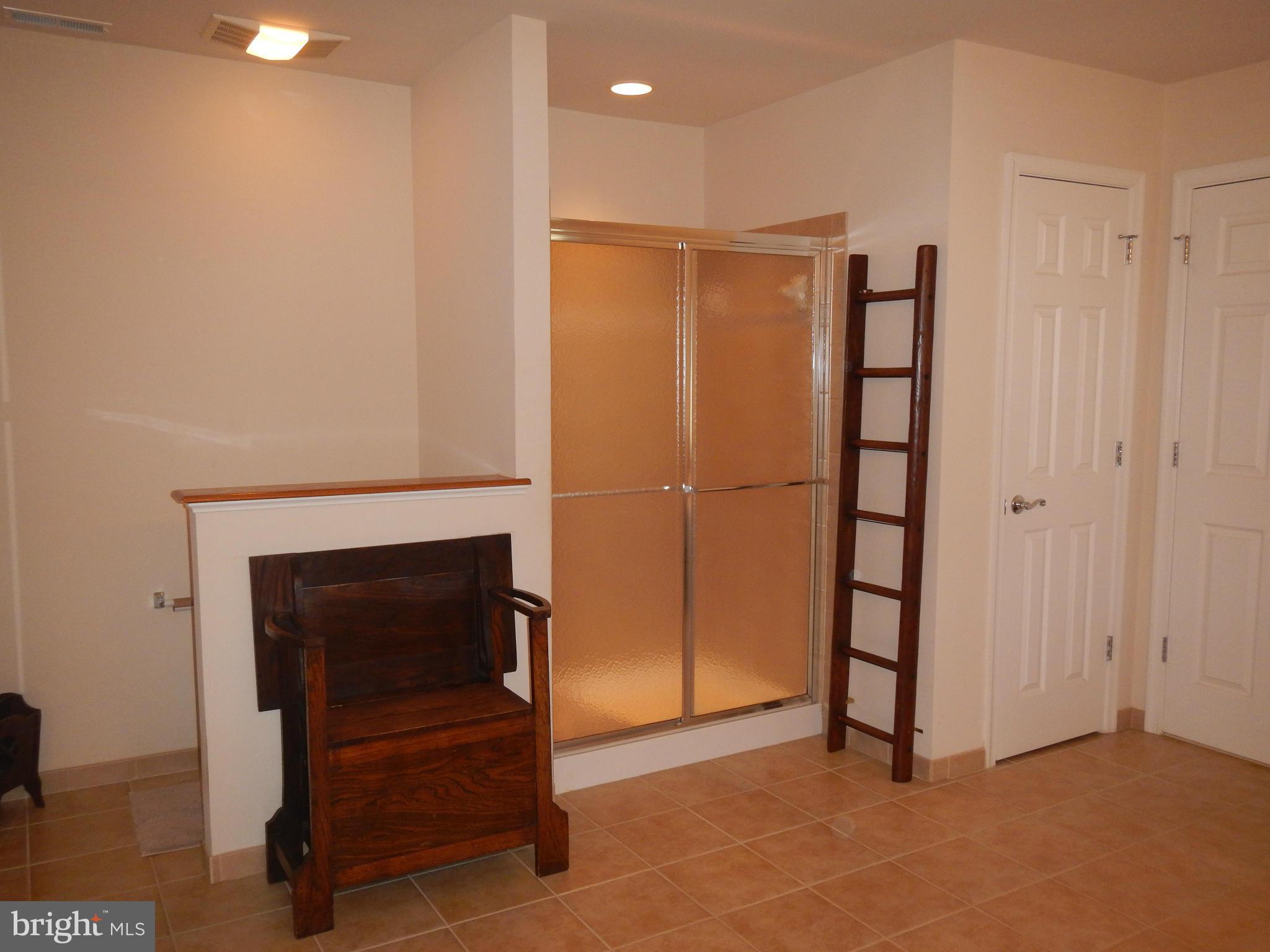 13602 Union Church Road Sumerduck, VA 22742 - Photo 20 of 30 a view of an empty room with wooden floor and a fireplace
