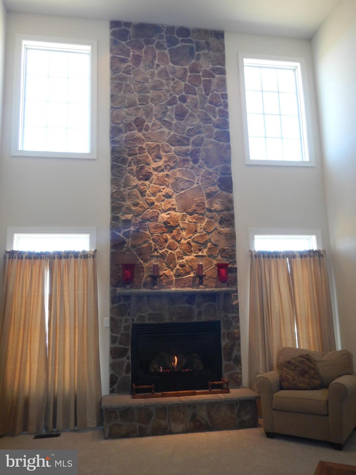 13602 Union Church Road Sumerduck, VA 22742 - Photo 9 of 30 a living room with a fireplace and a window