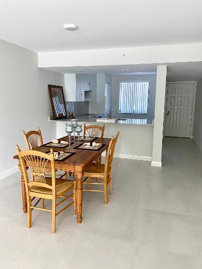 2101 Marina Isle Way, Unit 403 Jupiter, FL 33477 - Photo 2 of 3 a dining room with furniture and window