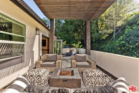 a outdoor living space with furniture and garden view