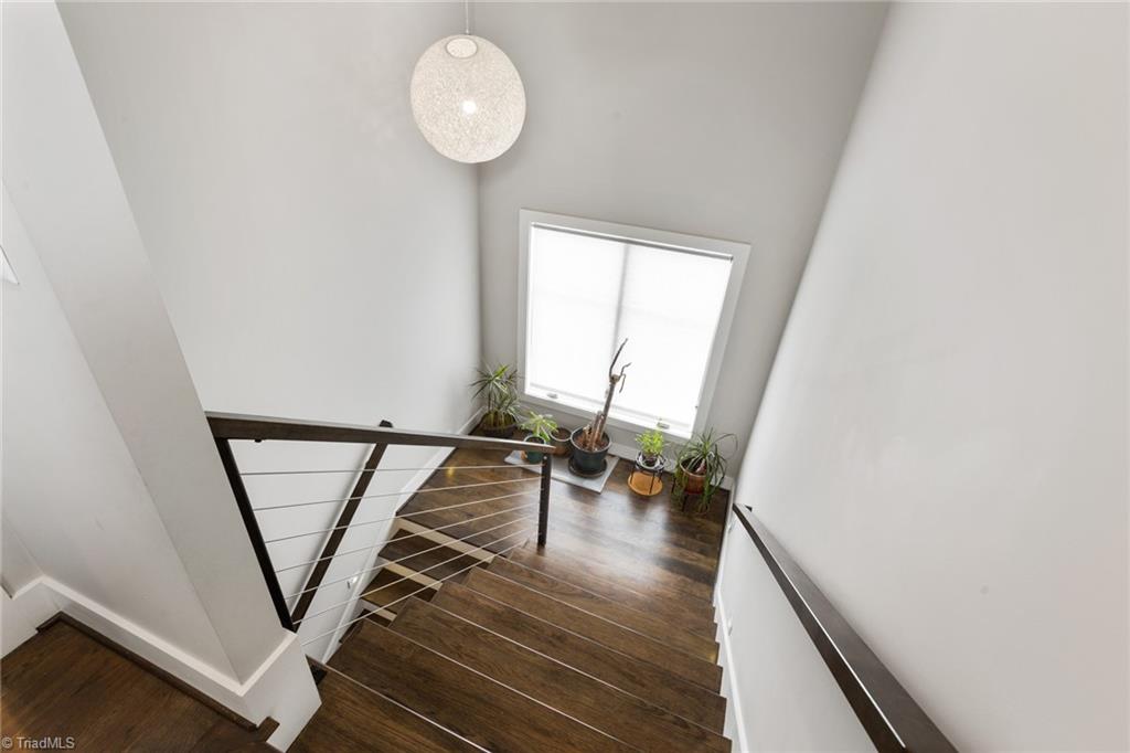 1074 Heron Ridge Road Winston-Salem, NC 27106 - Photo 33 of 50 Wonderful natural light-filled staircase to second floor featuring custom lighting