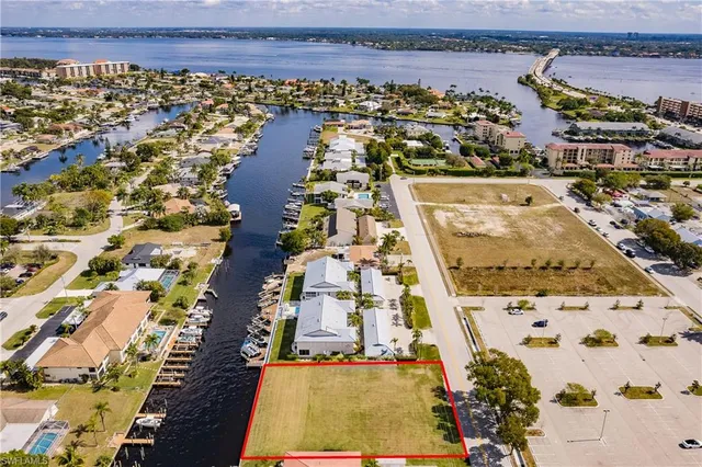 an aerial view of residential building and parking space