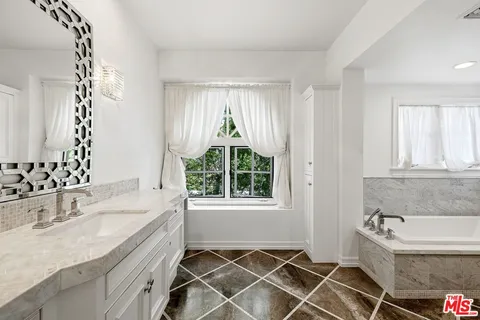 a bathroom with a sink and a bathtub