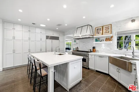a kitchen that has a cabinets and a sink