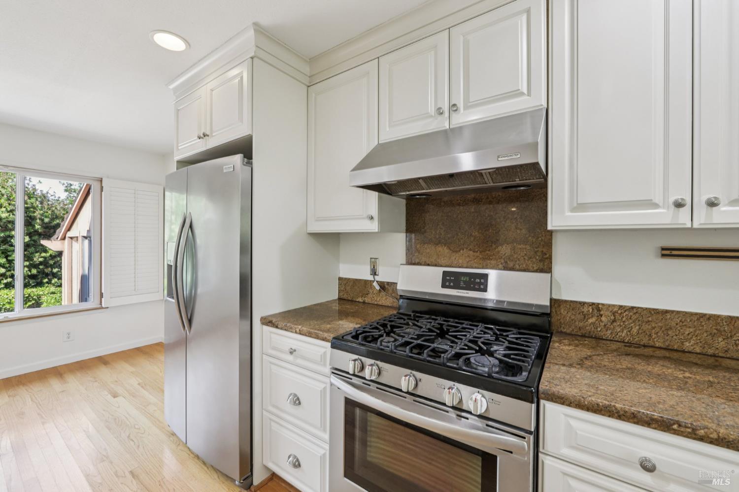 1050 Sunset Road Napa, CA 94558 - Photo 11 of 67 a kitchen with stainless steel appliances granite countertop a stove and a refrigerator