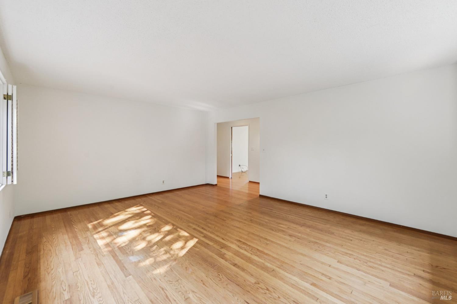 1050 Sunset Road Napa, CA 94558 - Photo 14 of 67 a view of an empty room and wooden floor