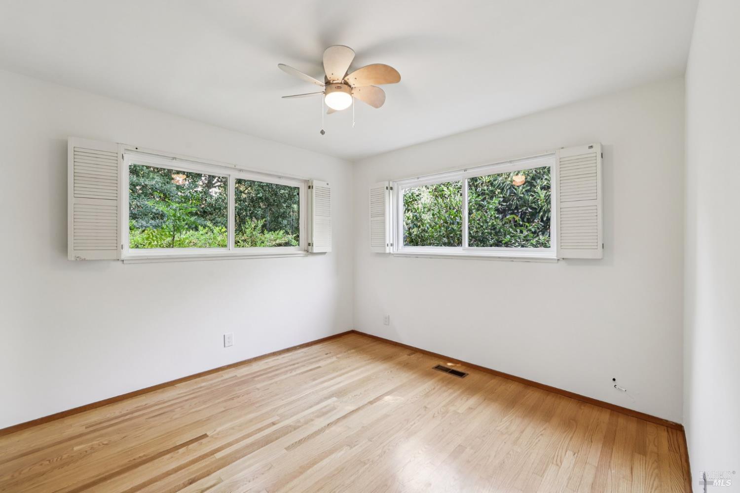 1050 Sunset Road Napa, CA 94558 - Photo 17 of 67 a view of an empty room with wooden floor and a window