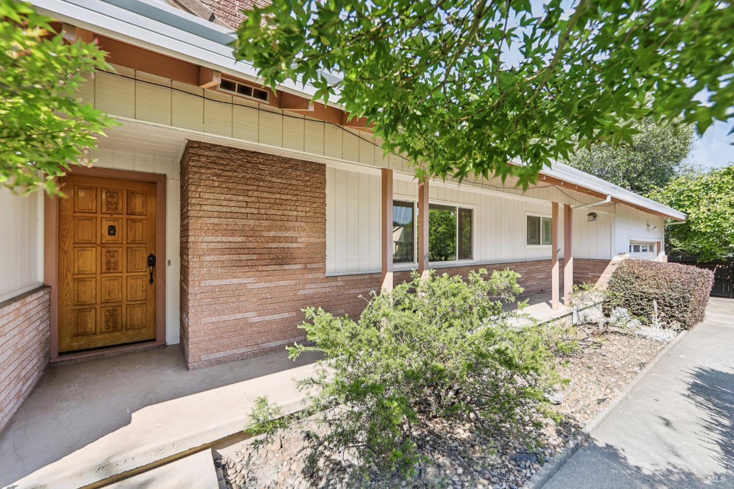 1050 Sunset Road Napa, CA 94558 - Photo 2 of 67 a view of a house with backyard