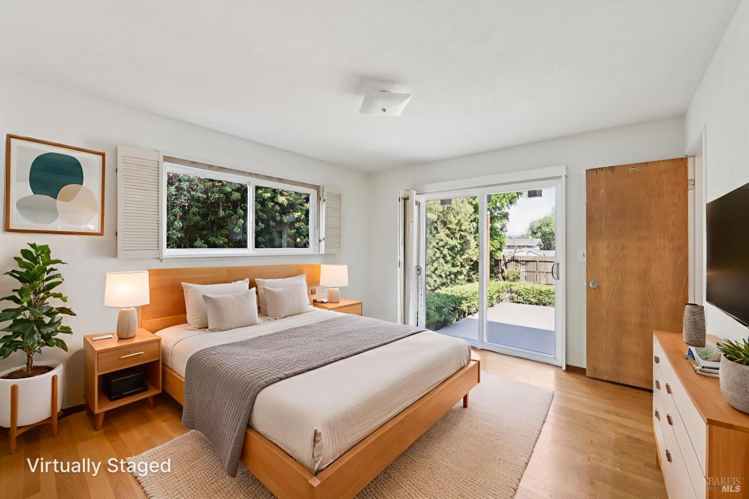 1050 Sunset Road Napa, CA 94558 - Photo 22 of 67 a bedroom with a bed and a flat tv screen on dresser