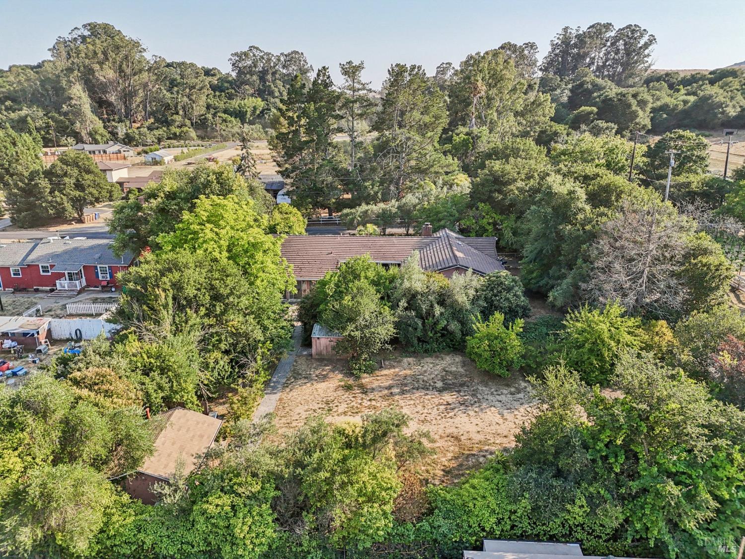1050 Sunset Road Napa, CA 94558 - Photo 61 of 67 a view of a garden with a building in front of it