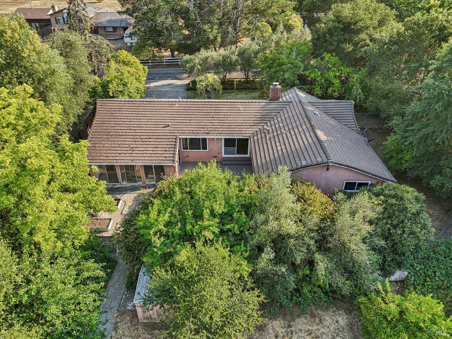 1050 Sunset Road Napa, CA 94558 - Photo 64 of 67 an aerial view of house with yard and trees in the background