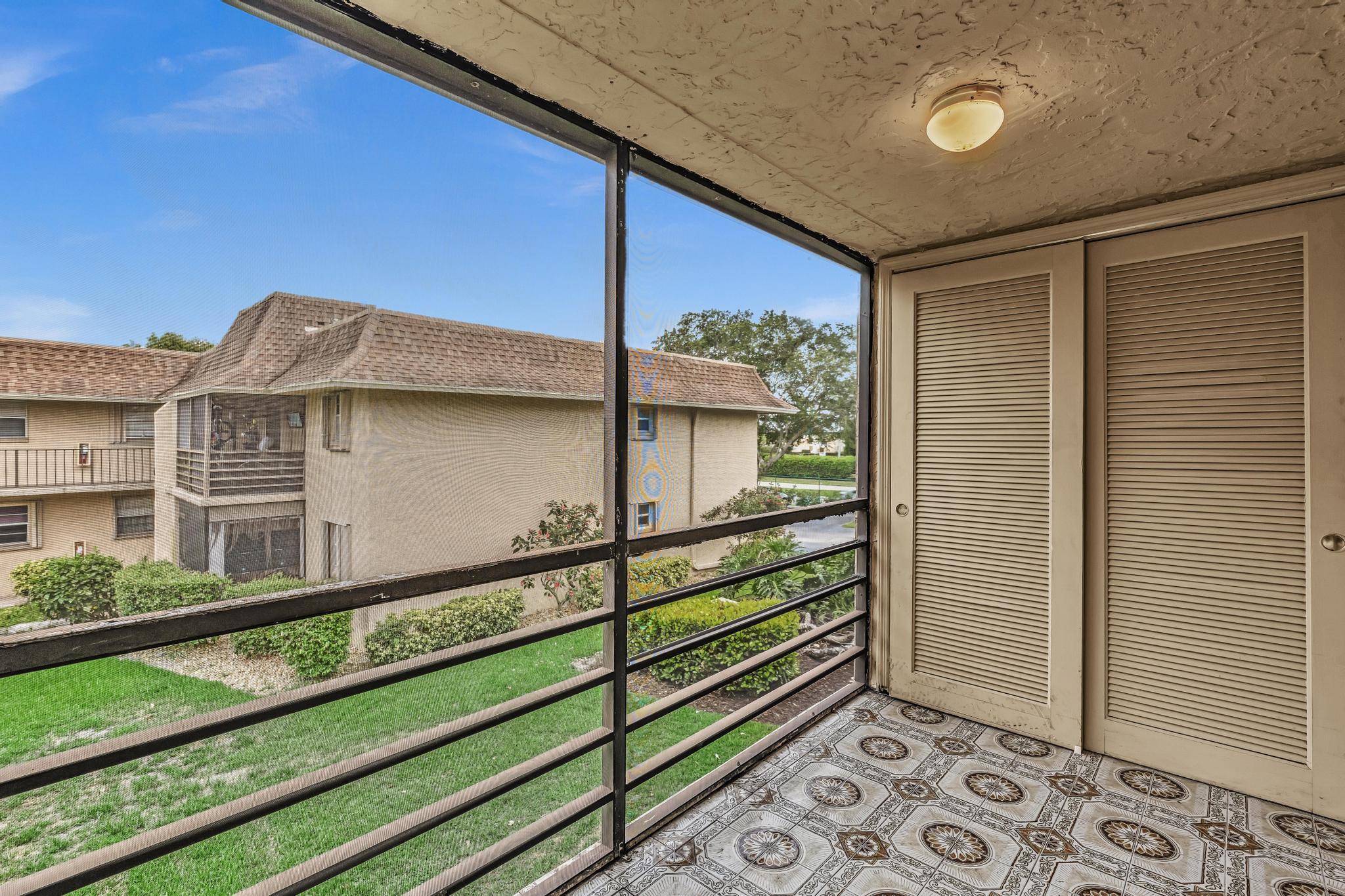 1291 Northwest 13th Street, Unit 445D Boca Raton, FL 33486 - Photo 15 of 50 a view of a house with a window