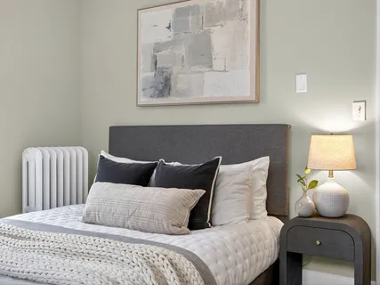 a bedroom with a bed and couch