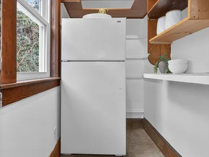 a view of a livingroom with furniture and window