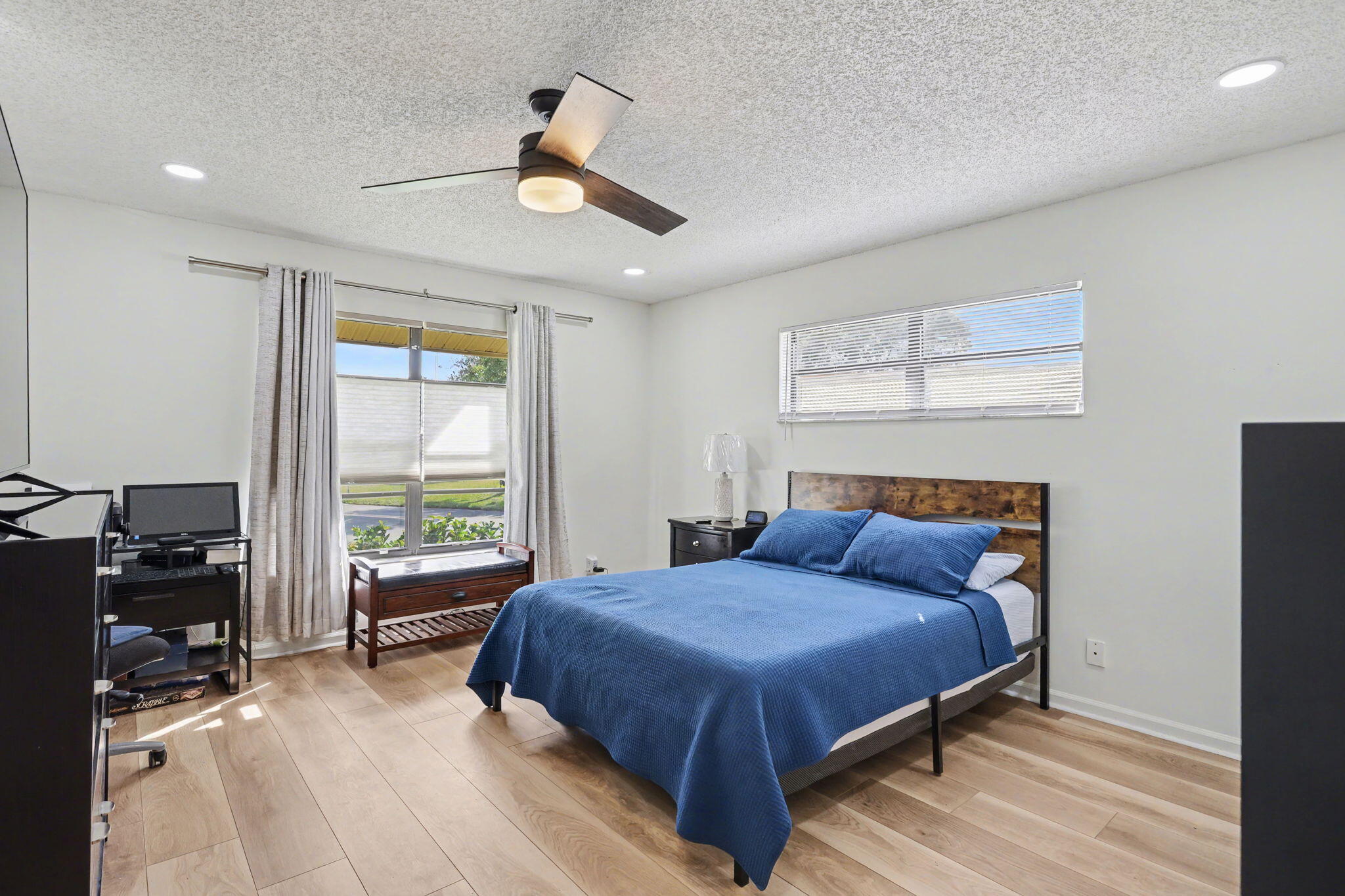 4635 Apple Tree Circle, Unit A Boynton Beach, FL 33436 - Photo 22 of 25 a bedroom with a large bed and a window