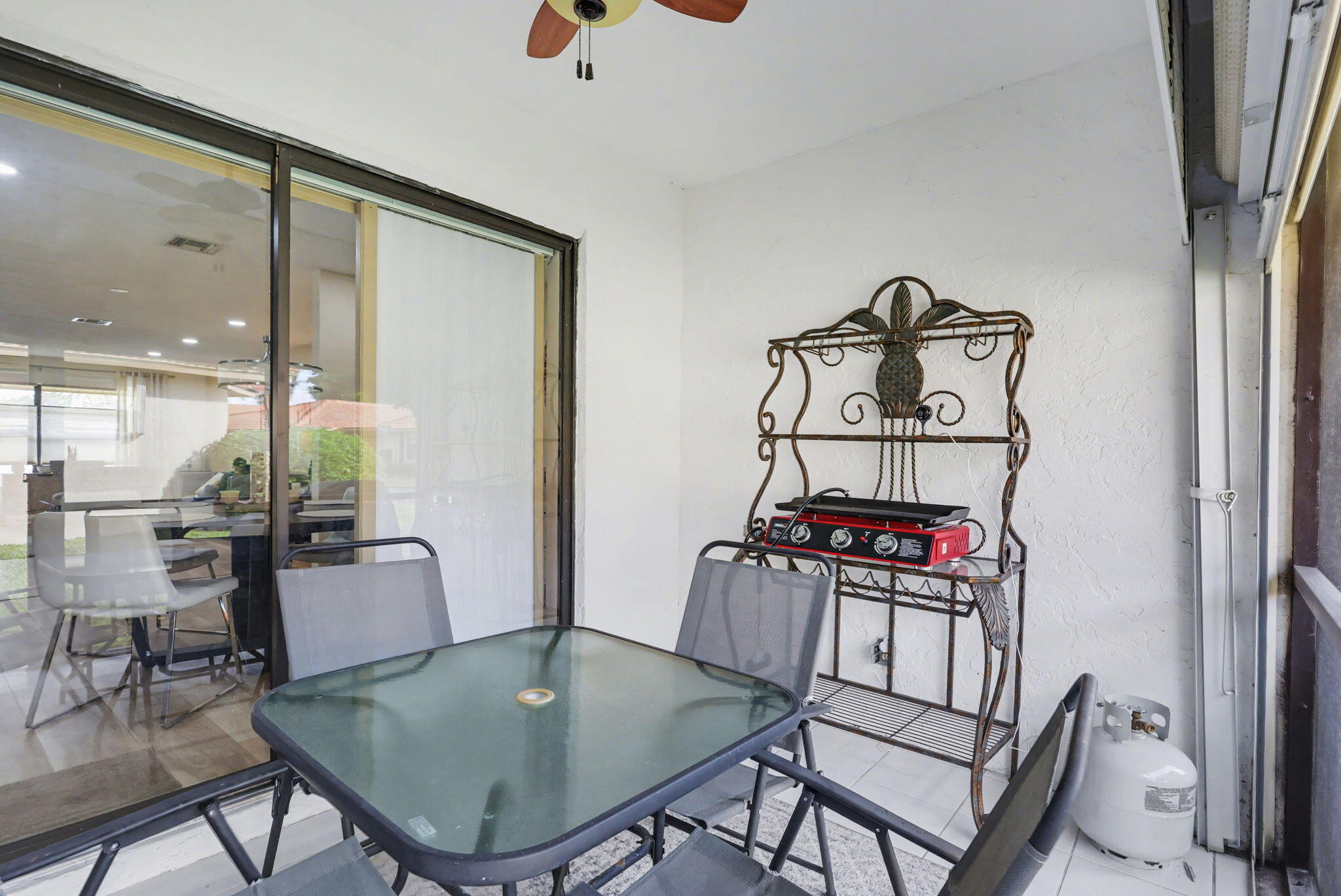 4635 Apple Tree Circle, Unit A Boynton Beach, FL 33436 - Photo 5 of 25 a view of a dining room with furniture and a potted plant