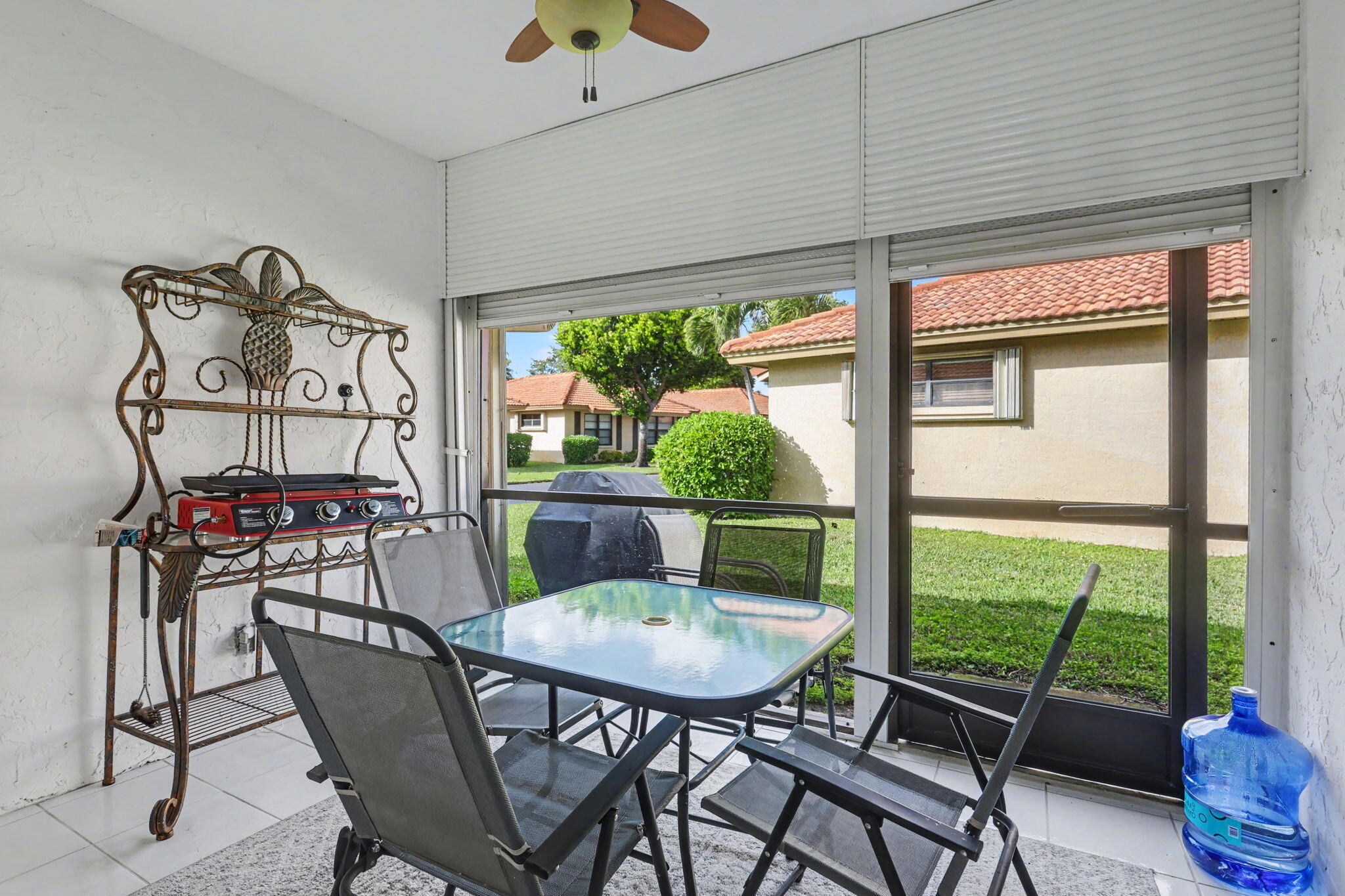 4635 Apple Tree Circle, Unit A Boynton Beach, FL 33436 - Photo 6 of 25 a view of a dining room with furniture window and outside view