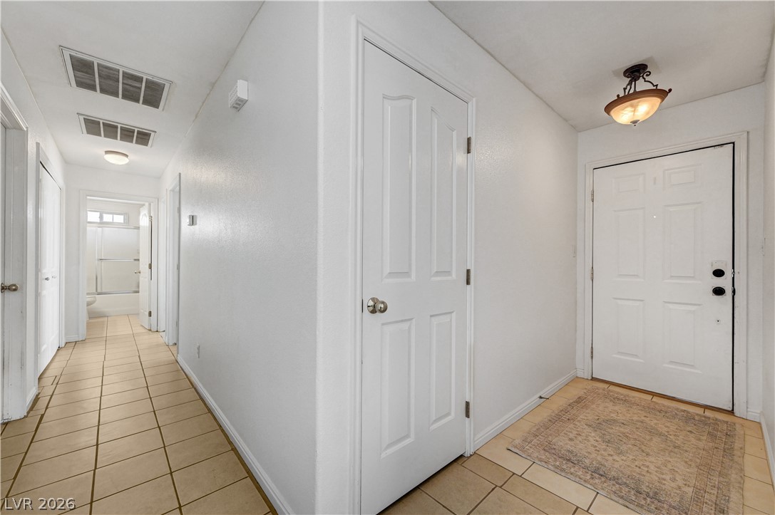 1272 Liston Avenue Logandale, NV 89021 - Photo 14 of 61 A welcoming entryway with durable tile flooring connects to the home's various rooms.