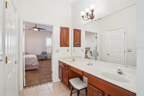 a spacious bathroom with a sink double vanity and a mirror