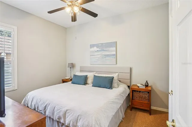 a bedroom with a bed and window