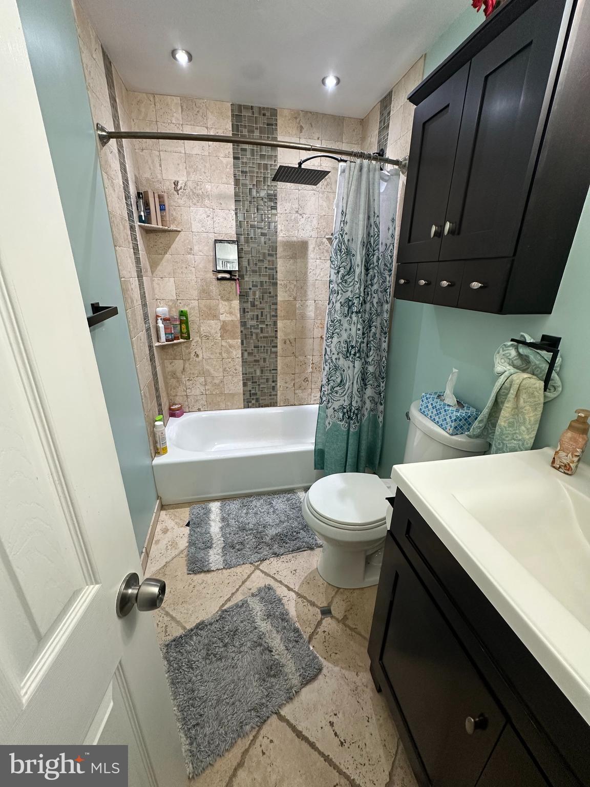 30 Williams Way Downingtown, PA 19335 - Photo 24 of 31 a bathroom with a sink a toilet a mirror and shower