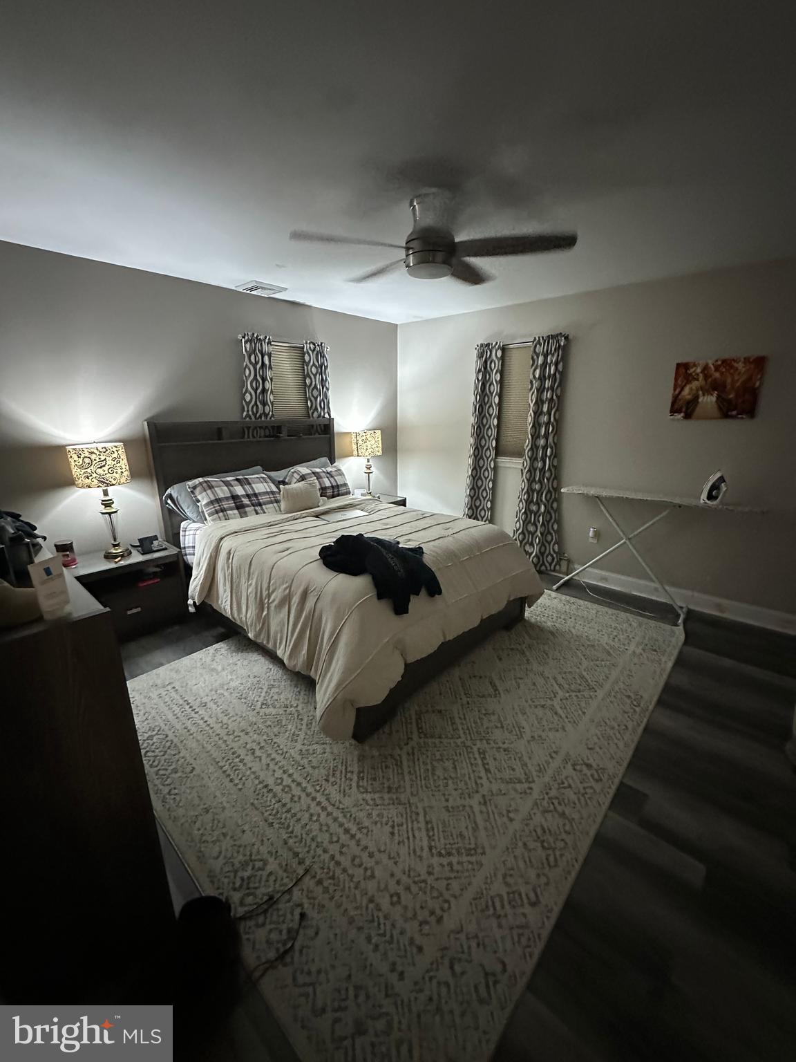 30 Williams Way Downingtown, PA 19335 - Photo 27 of 31 a bedroom with a large bed and a chandelier