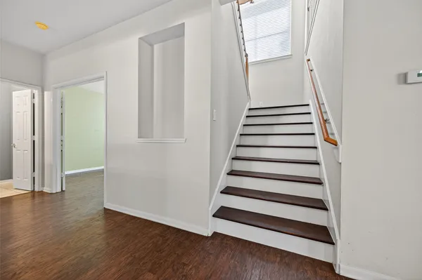 a view of entryway with wooden floor