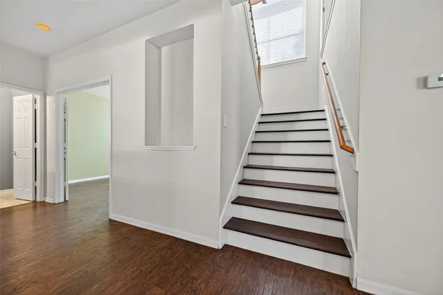 a view of entryway with wooden floor