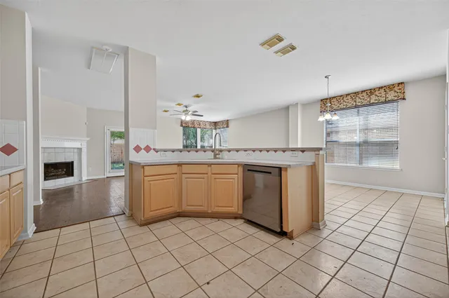 a kitchen with a sink cabinets and appliances