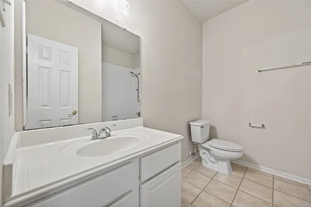 a bathroom with a sink toilet and vanity