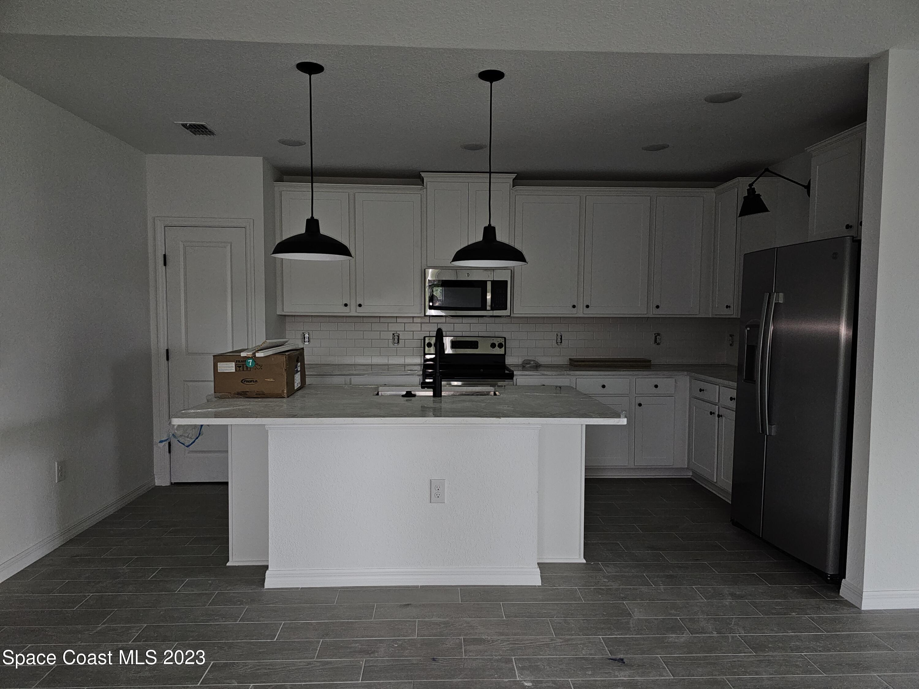 1302 Zanzibar Road Southeast Palm Bay, FL 32909 - Photo 3 of 10 20231127_111301