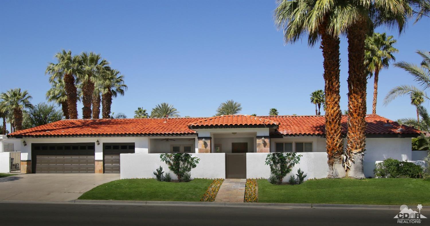 75570 Fairway Drive Indian Wells, CA 92210 - Photo 1 of 38 a front view of a house with a garden