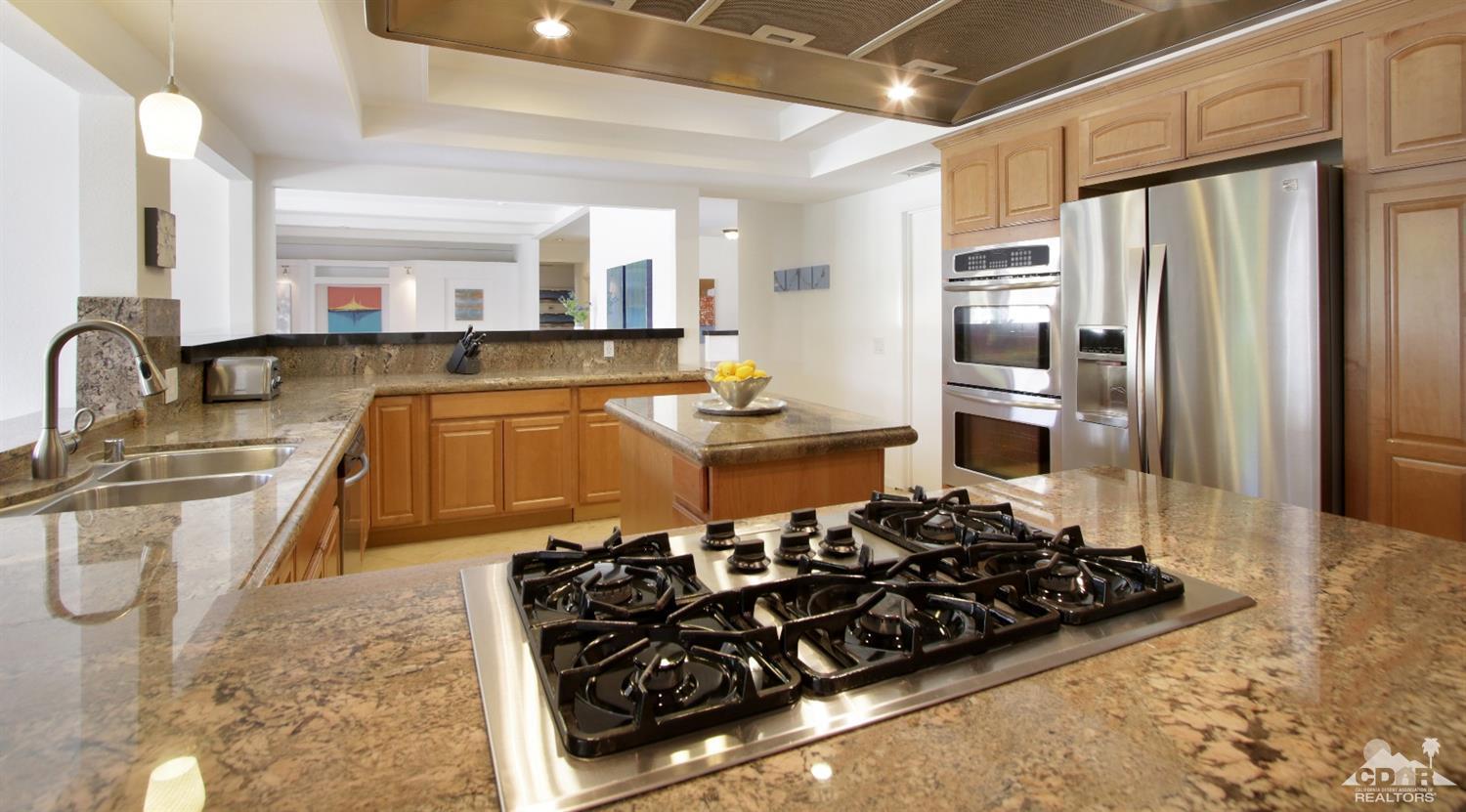 75570 Fairway Drive Indian Wells, CA 92210 - Photo 13 of 38 a kitchen with stainless steel appliances a sink stove and refrigerator