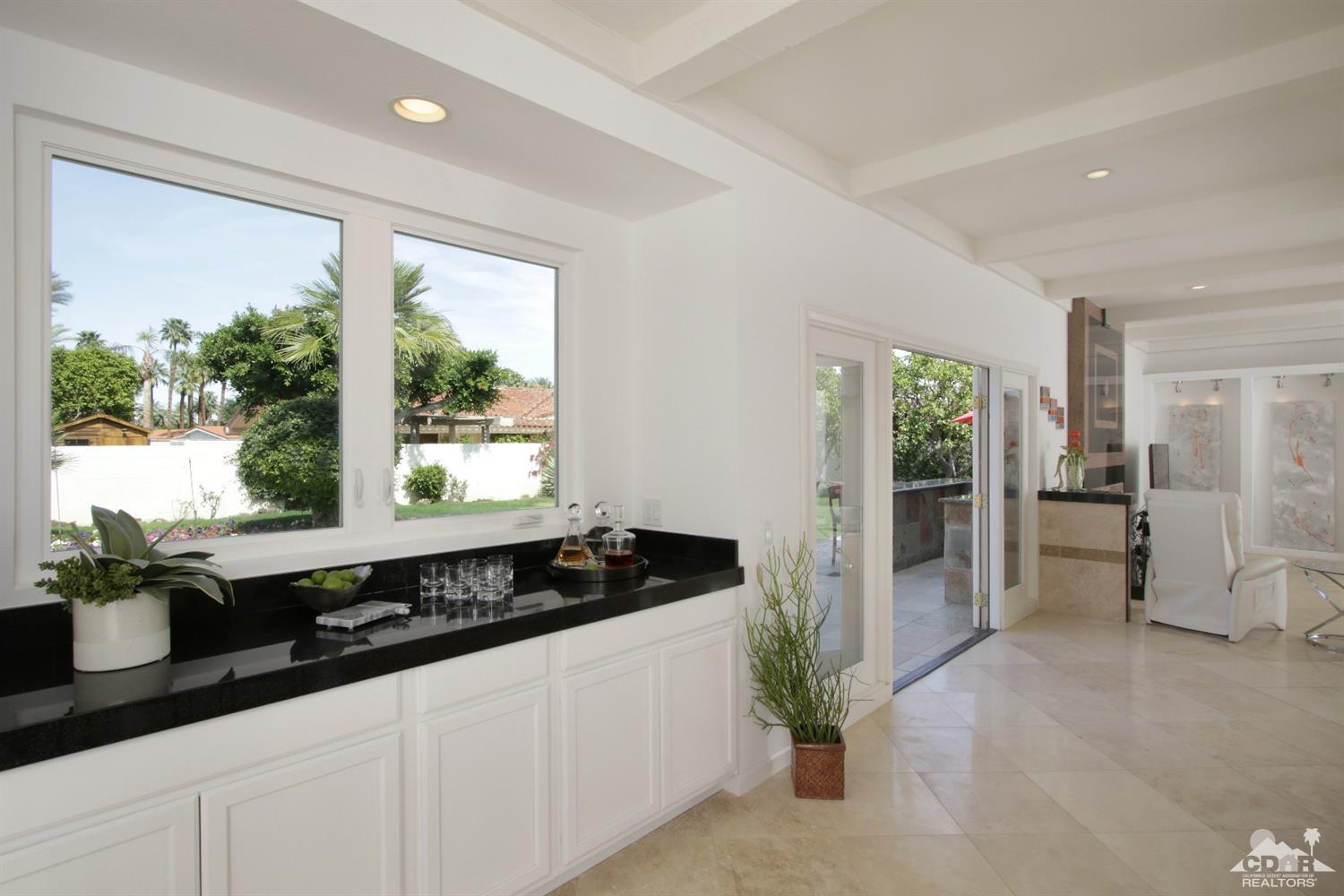 75570 Fairway Drive Indian Wells, CA 92210 - Photo 14 of 38 a kitchen with a sink and white cabinets