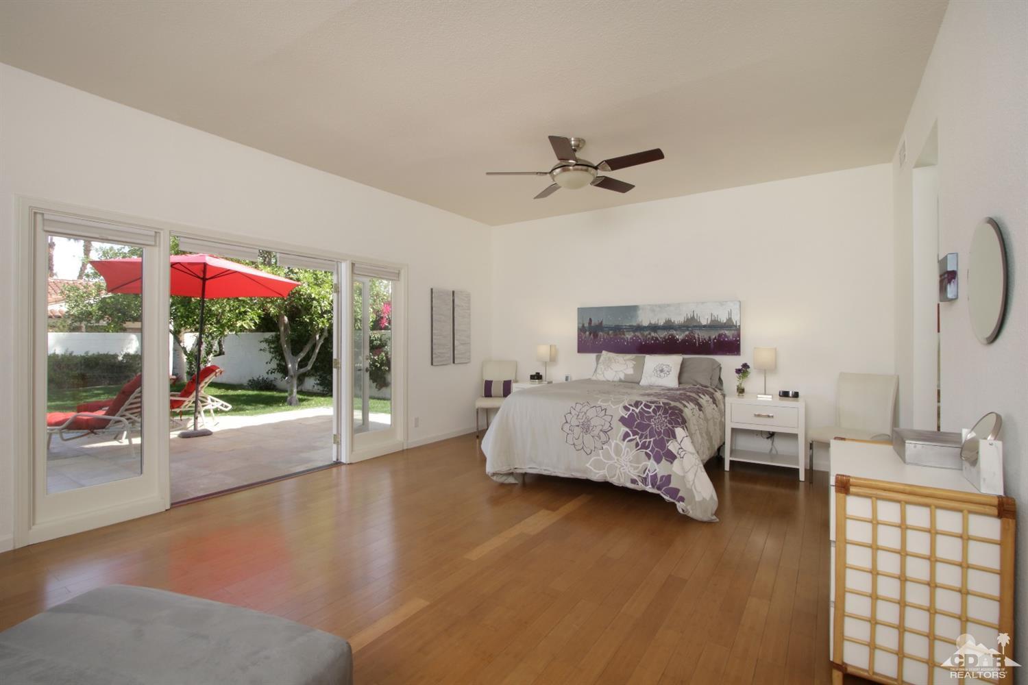 75570 Fairway Drive Indian Wells, CA 92210 - Photo 16 of 38 a bedroom with a bed and glass walk in closet