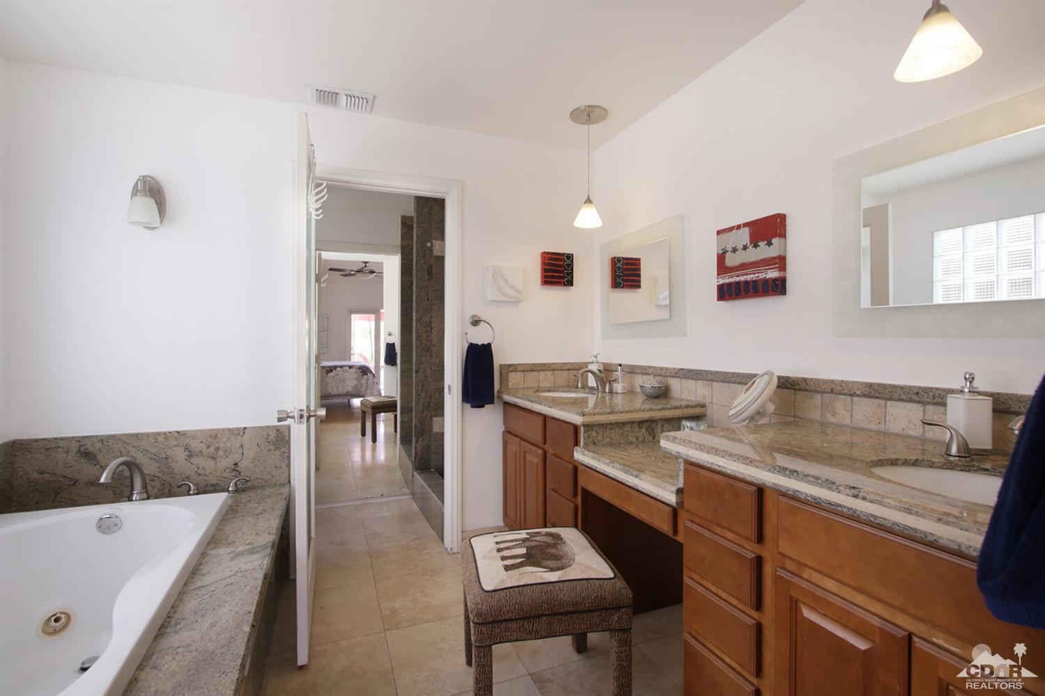 75570 Fairway Drive Indian Wells, CA 92210 - Photo 18 of 38 a kitchen with a sink stove and cabinets