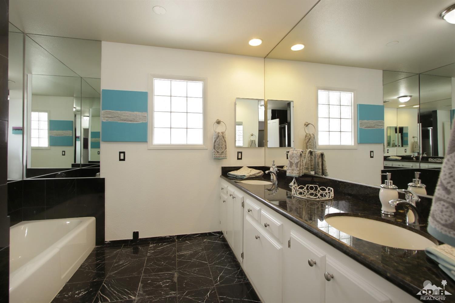75570 Fairway Drive Indian Wells, CA 92210 - Photo 21 of 38 a kitchen with a sink stove and cabinets