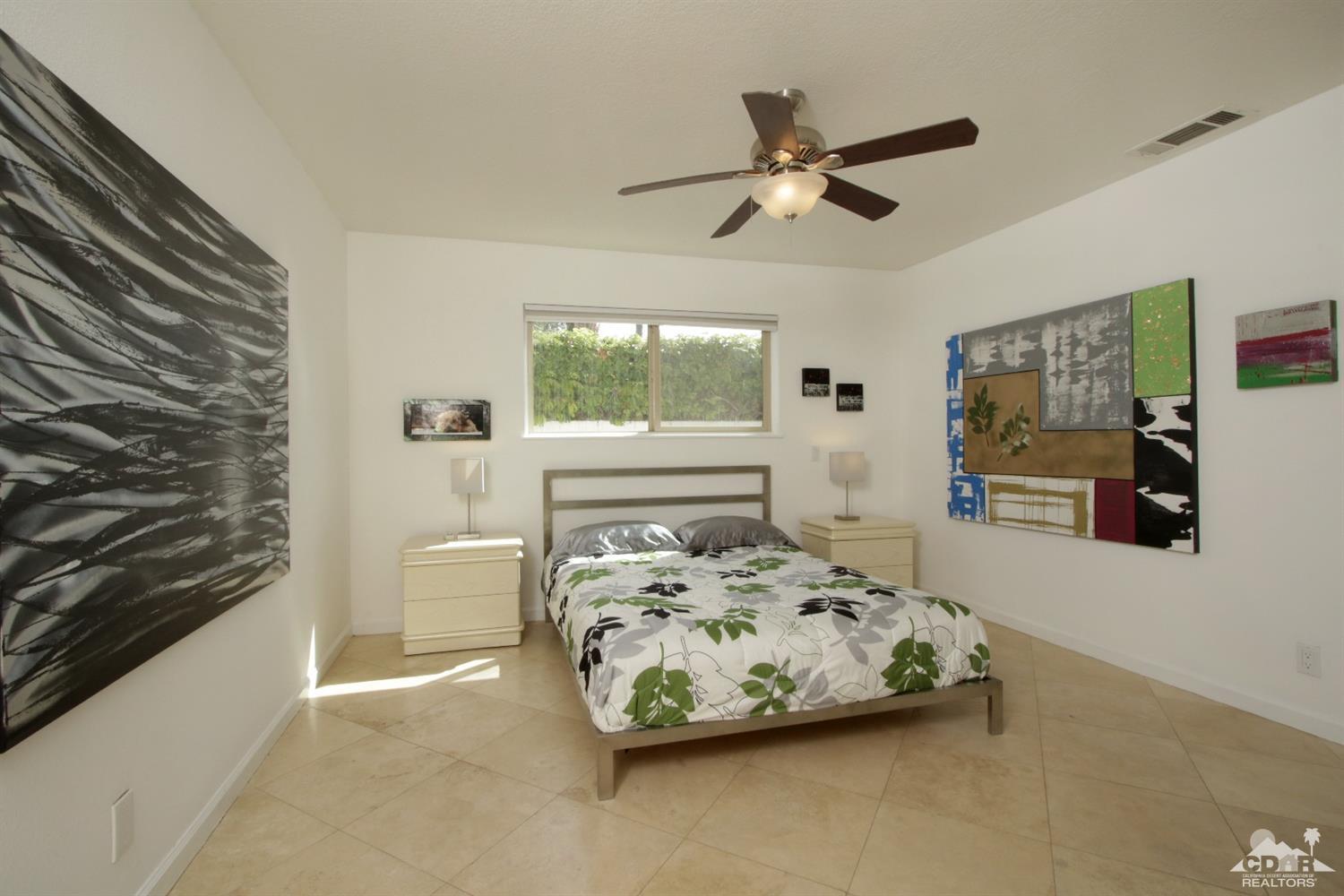 75570 Fairway Drive Indian Wells, CA 92210 - Photo 22 of 38 a bedroom with a bed and window