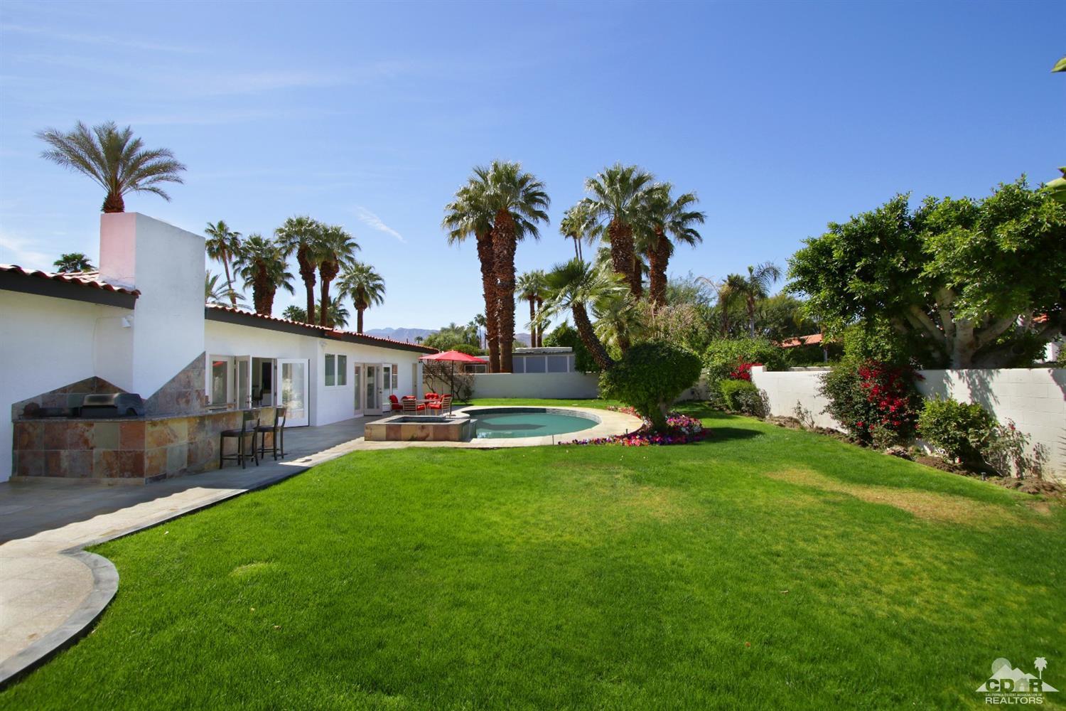 75570 Fairway Drive Indian Wells, CA 92210 - Photo 29 of 38 a view of a house with a yard and sitting area