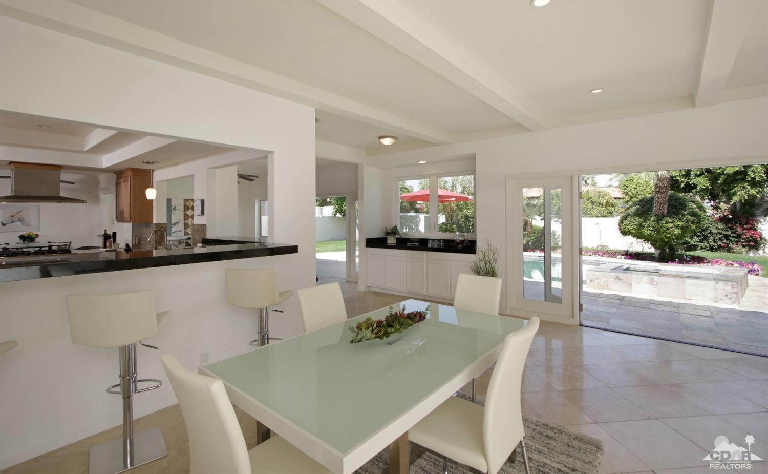 75570 Fairway Drive Indian Wells, CA 92210 - Photo 9 of 38 a view of a dining room with furniture and a kitchen