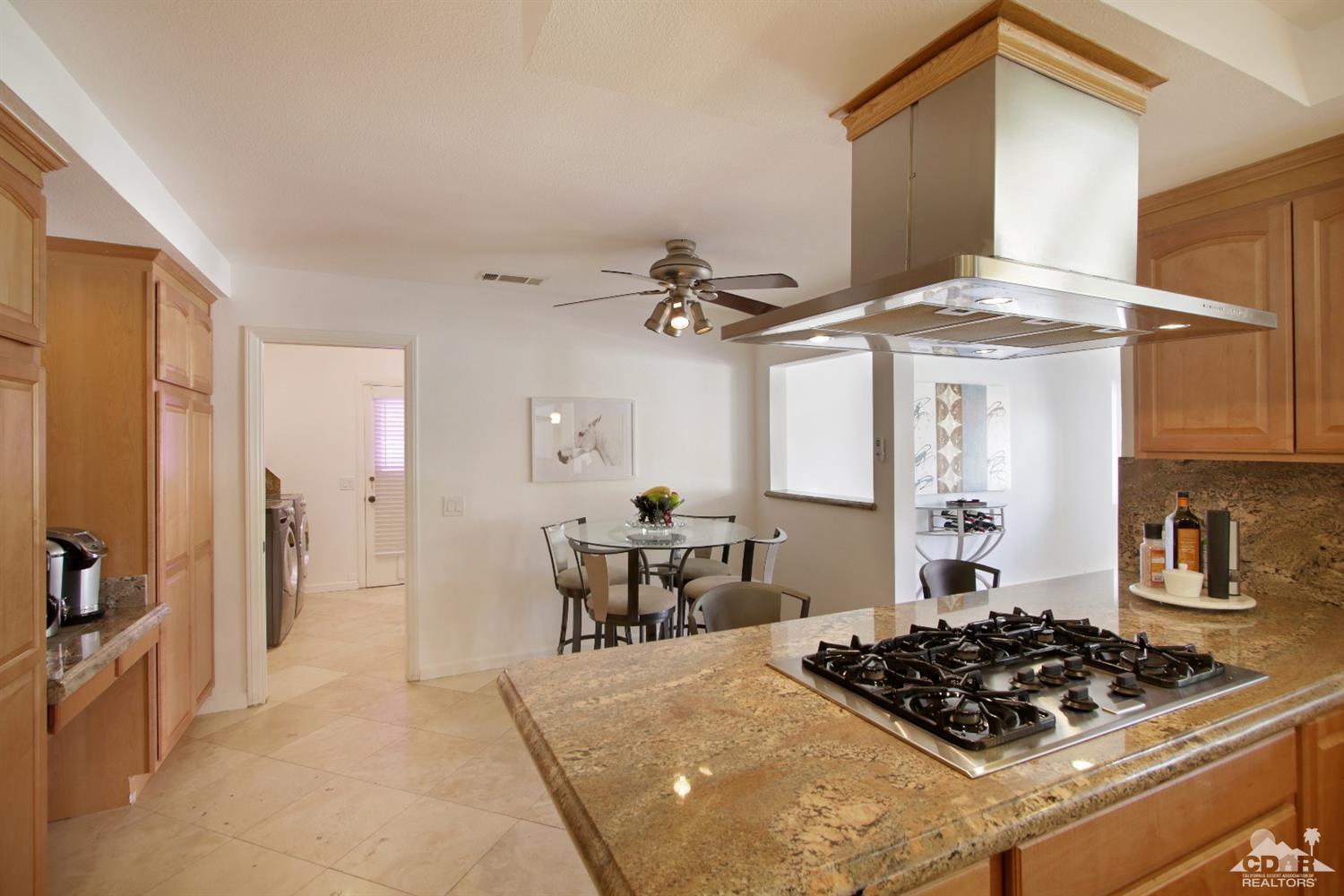 75570 Fairway Drive Indian Wells, CA 92210 - Photo 10 of 38 a kitchen with a stove and a refrigerator