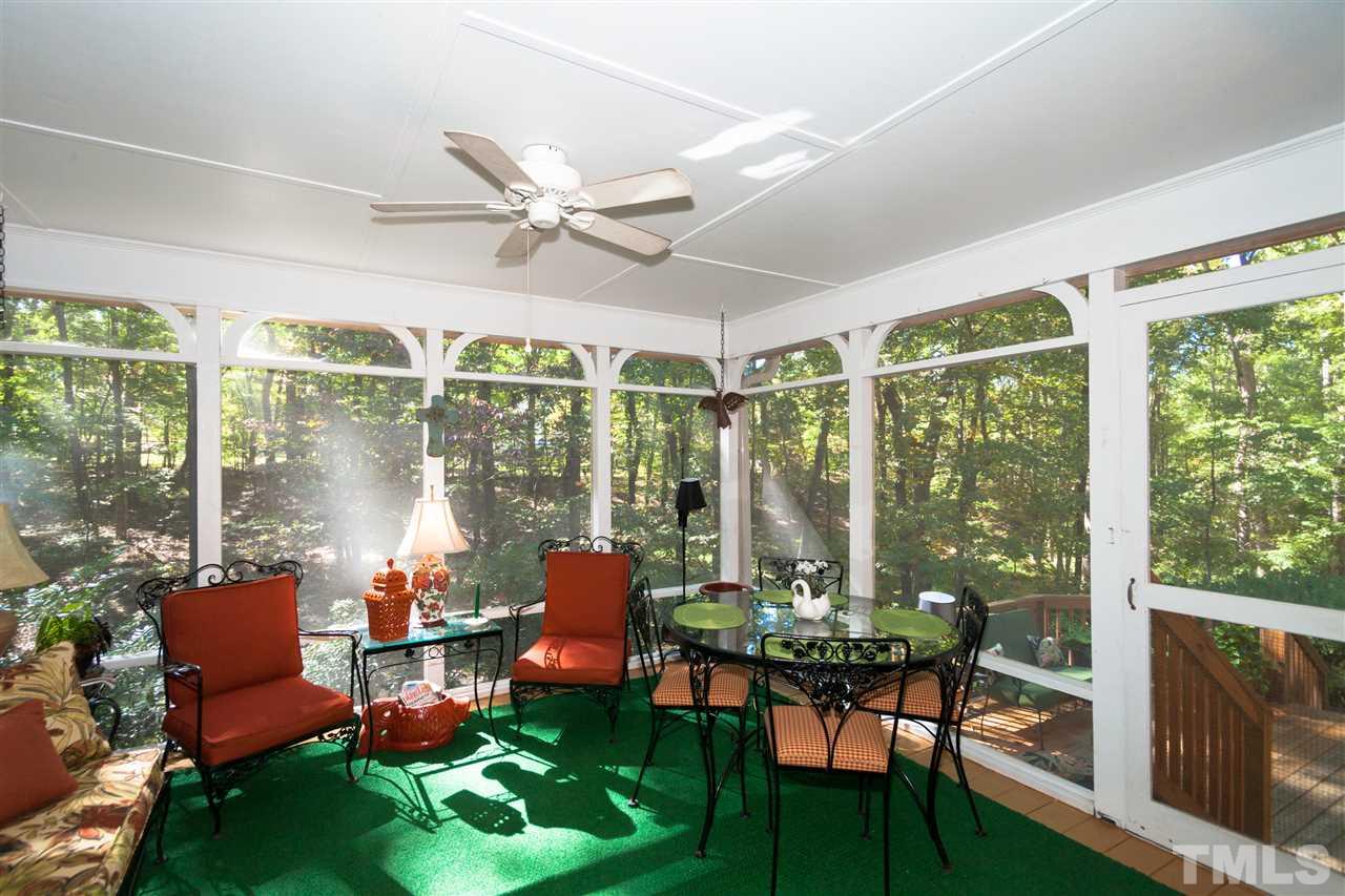 3372 Henley Road Sanford, NC 27330 - Photo 22 of 24 Enjoy the screened porch while overlooking your large private lot!