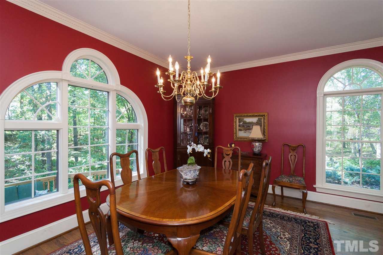 3372 Henley Road Sanford, NC 27330 - Photo 6 of 24 Dining room is open to living room with large windows and hardwood floors