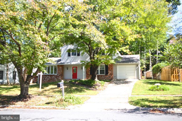 13007 Middlevale Lane Silver Spring, MD 20906 - Photo 1 of 30 a front view of a house with a yard